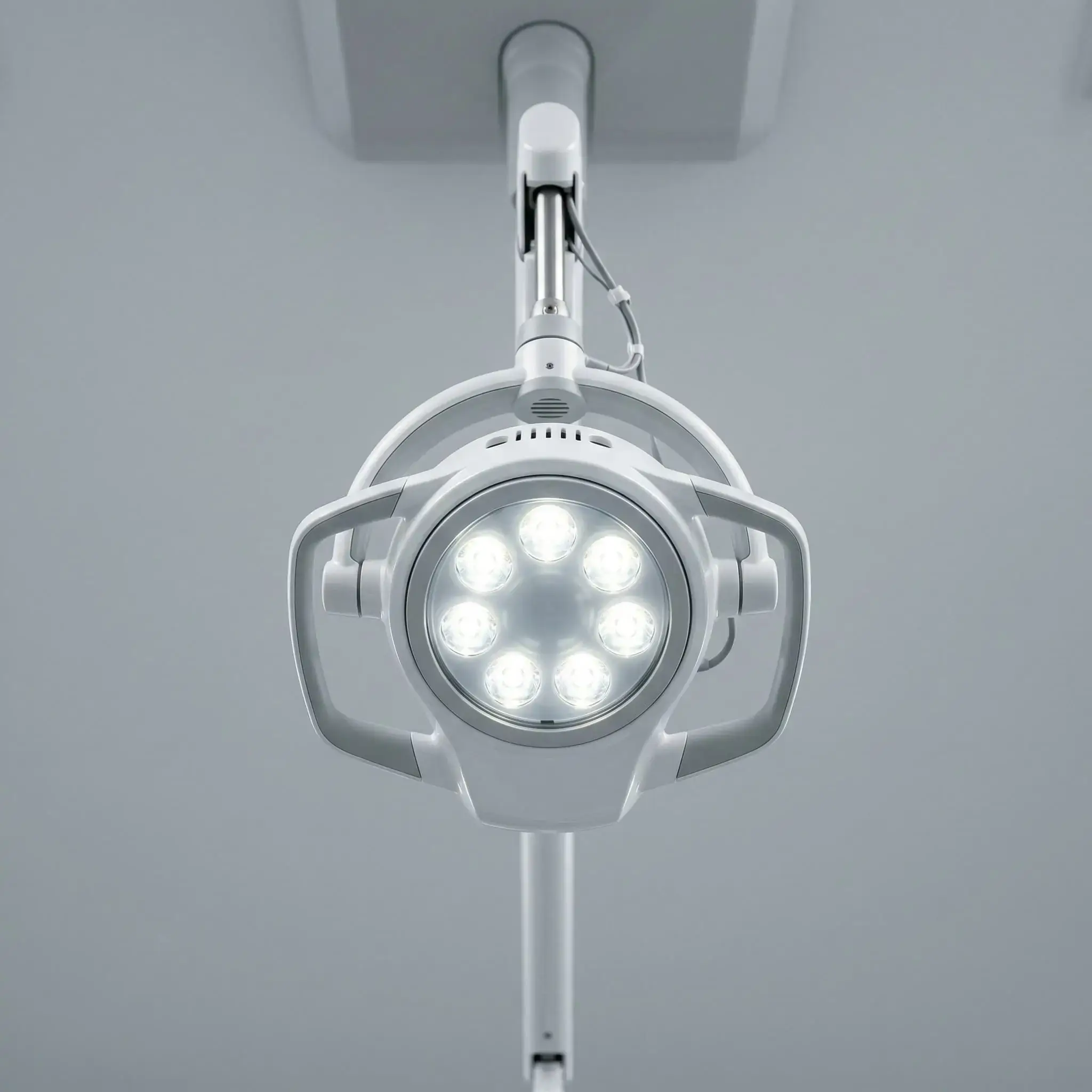 Water flosser tip with a single drop against a white background