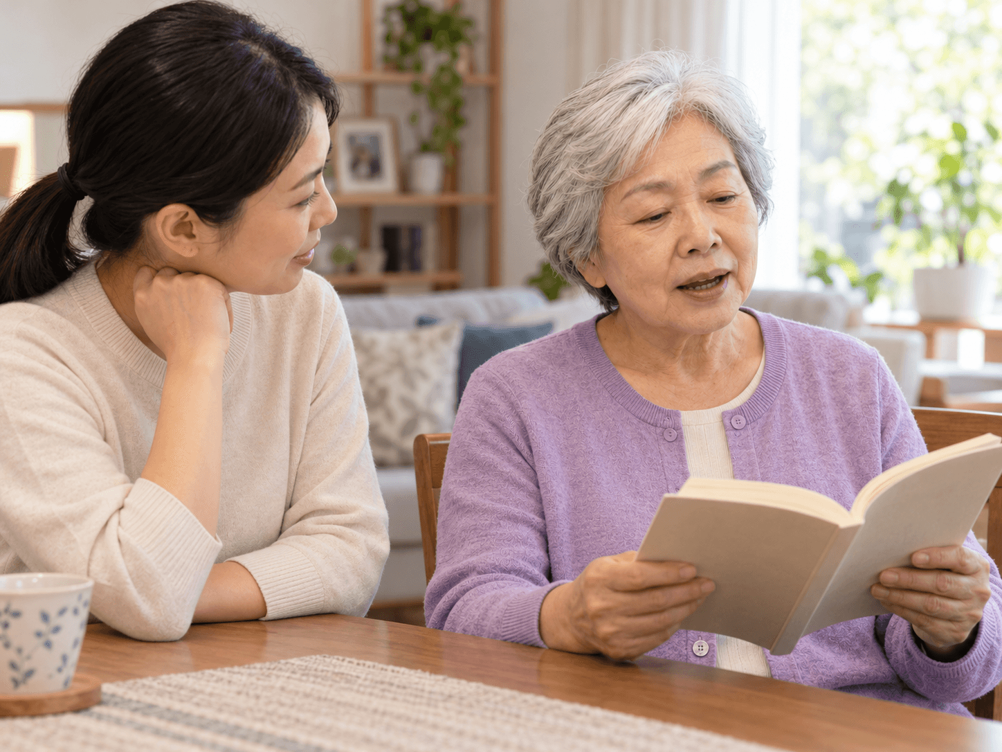 The woman practises reading aloud at home with her daughter beside her.