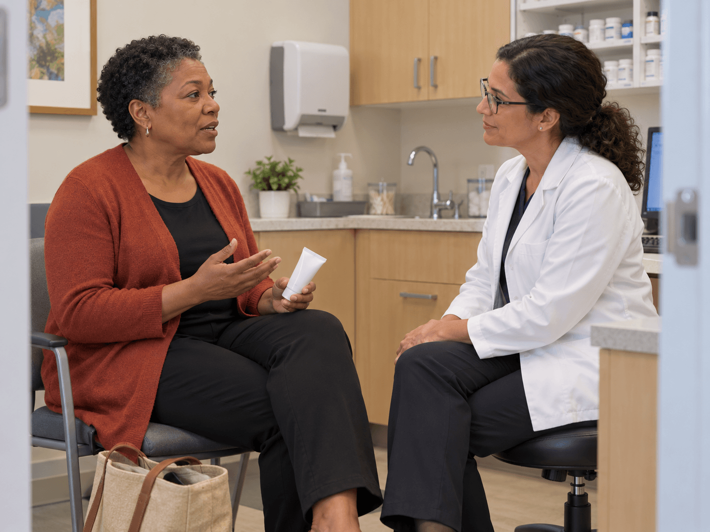 A woman asks a pharmacist about a mouth-care product during a private consultation.